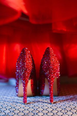 red sparkling heels with red backdrop