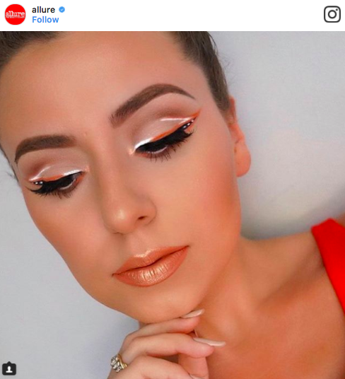 woman with orange and white eyeliner