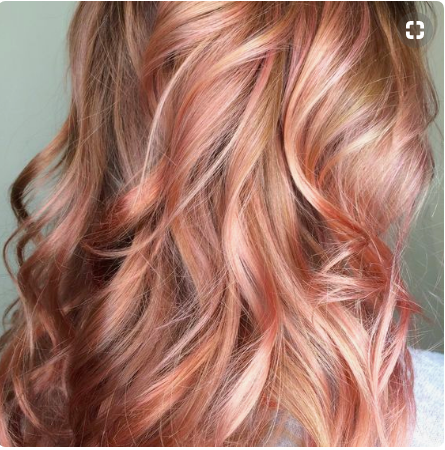 Woman with rose gold hair.